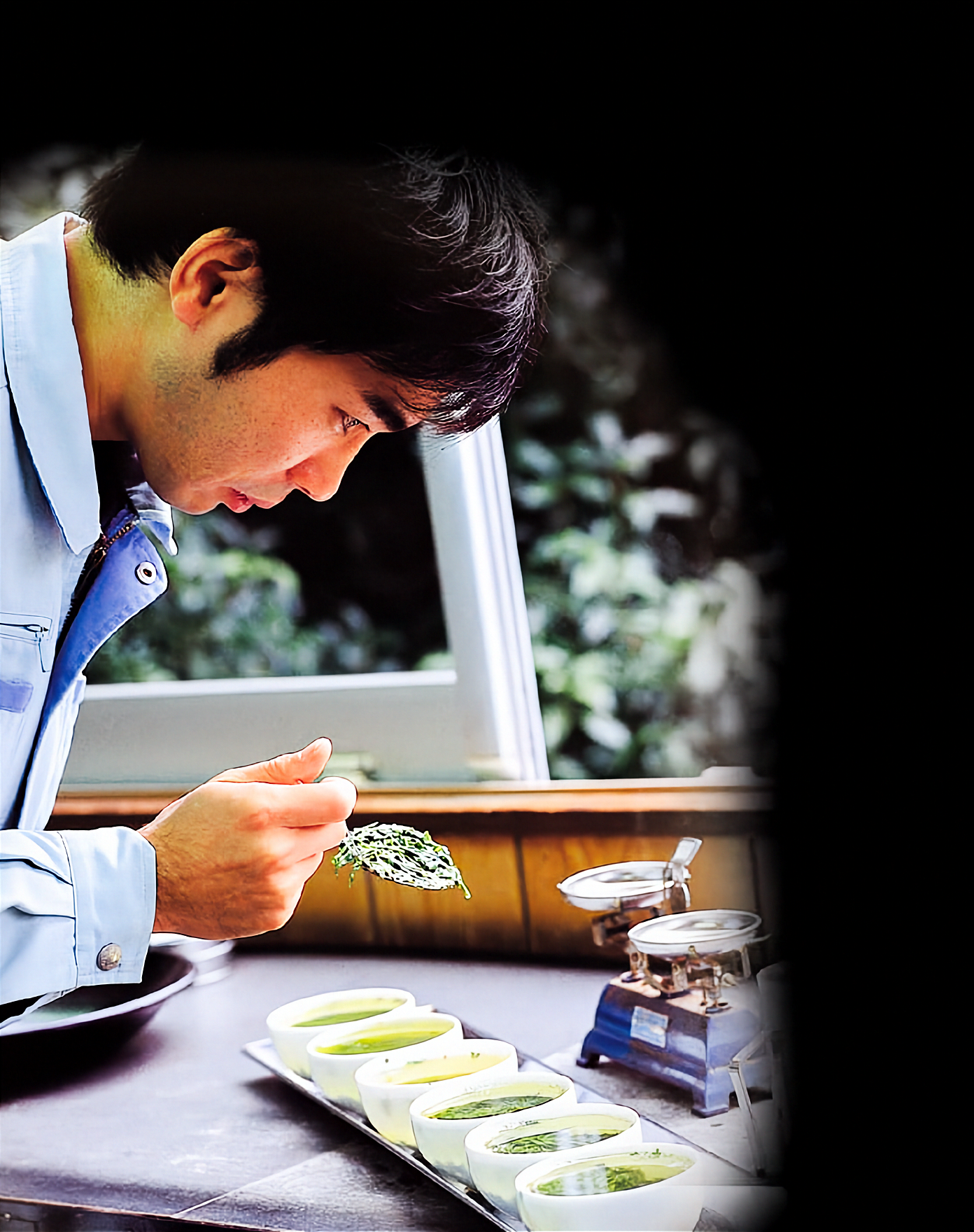 A master tea blender crafting the signature matcha blend at Fuji Asahien