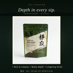 Matcha Sei-Jaku product hero shot — a silver aluminum pouch surrounded by deep green matcha powder and fresh tea leaves, conveying premium quality